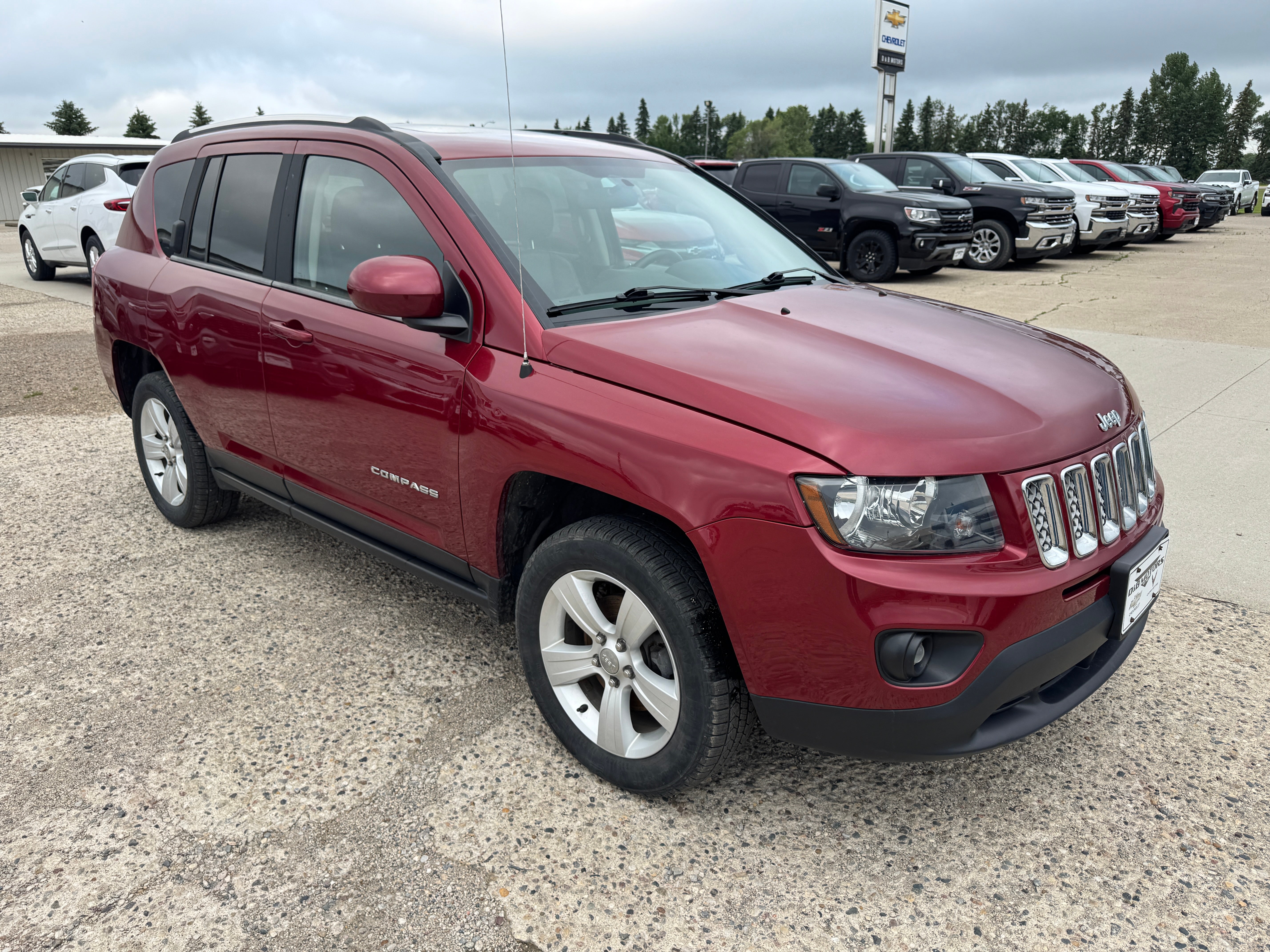 2014 Jeep Compass Latitude in Red — front three-quarter view