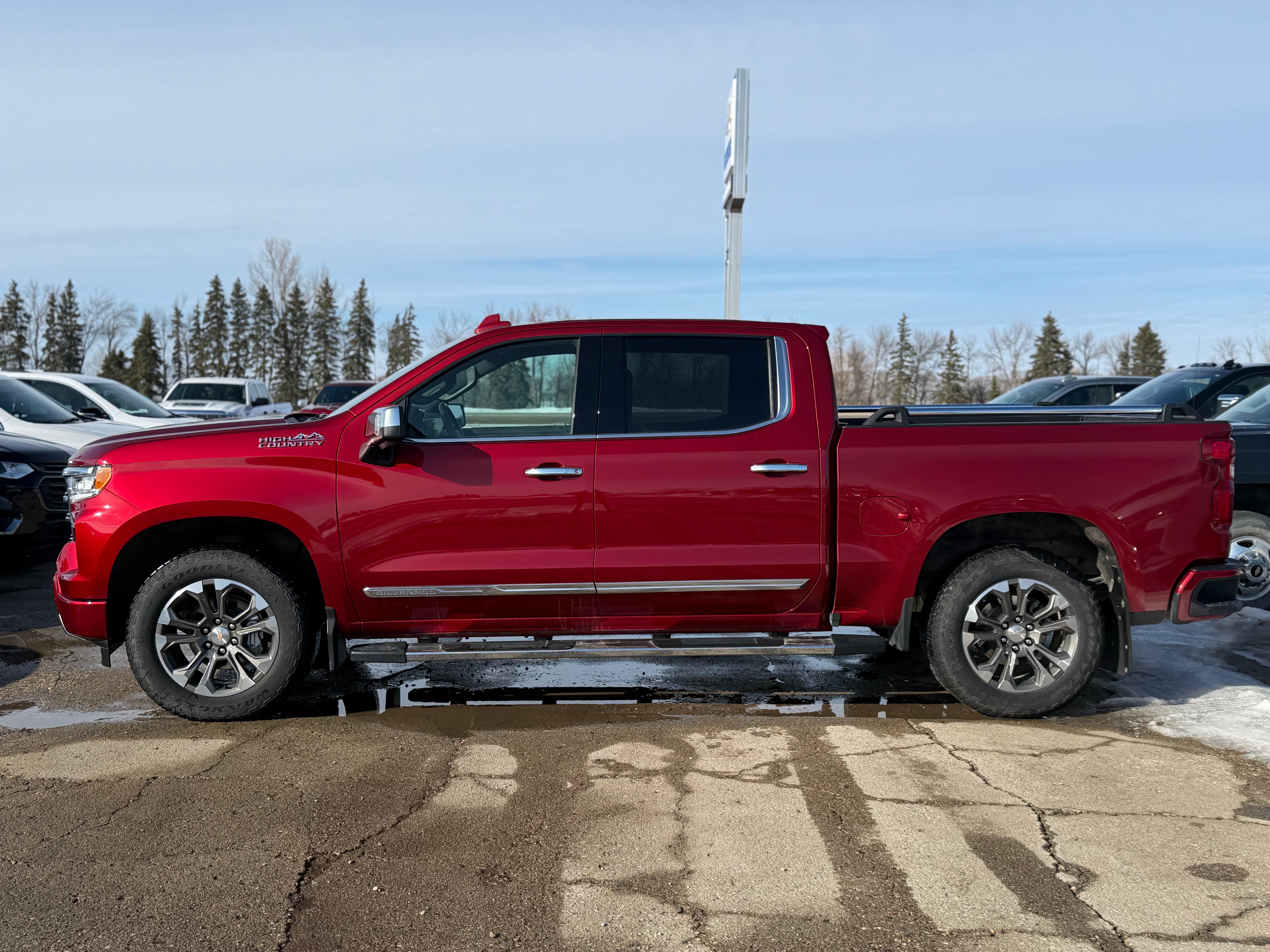 2023 Chevrolet Silverado 1500 High Country in Radiant Red Tintcoat — front three-quarter view
