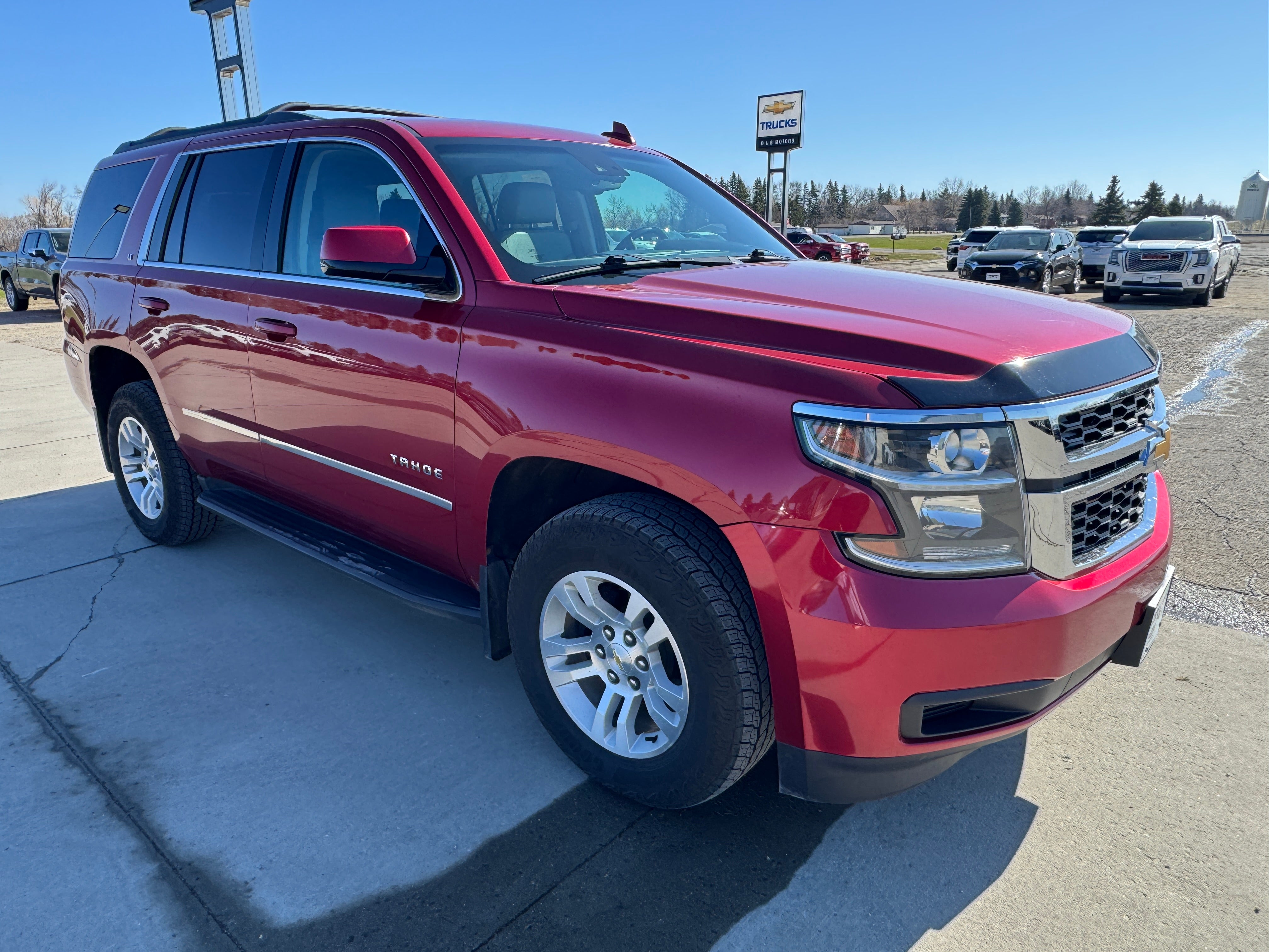 2015 Chevrolet Tahoe LT in Crystal Red Tintcoat — front three-quarter view