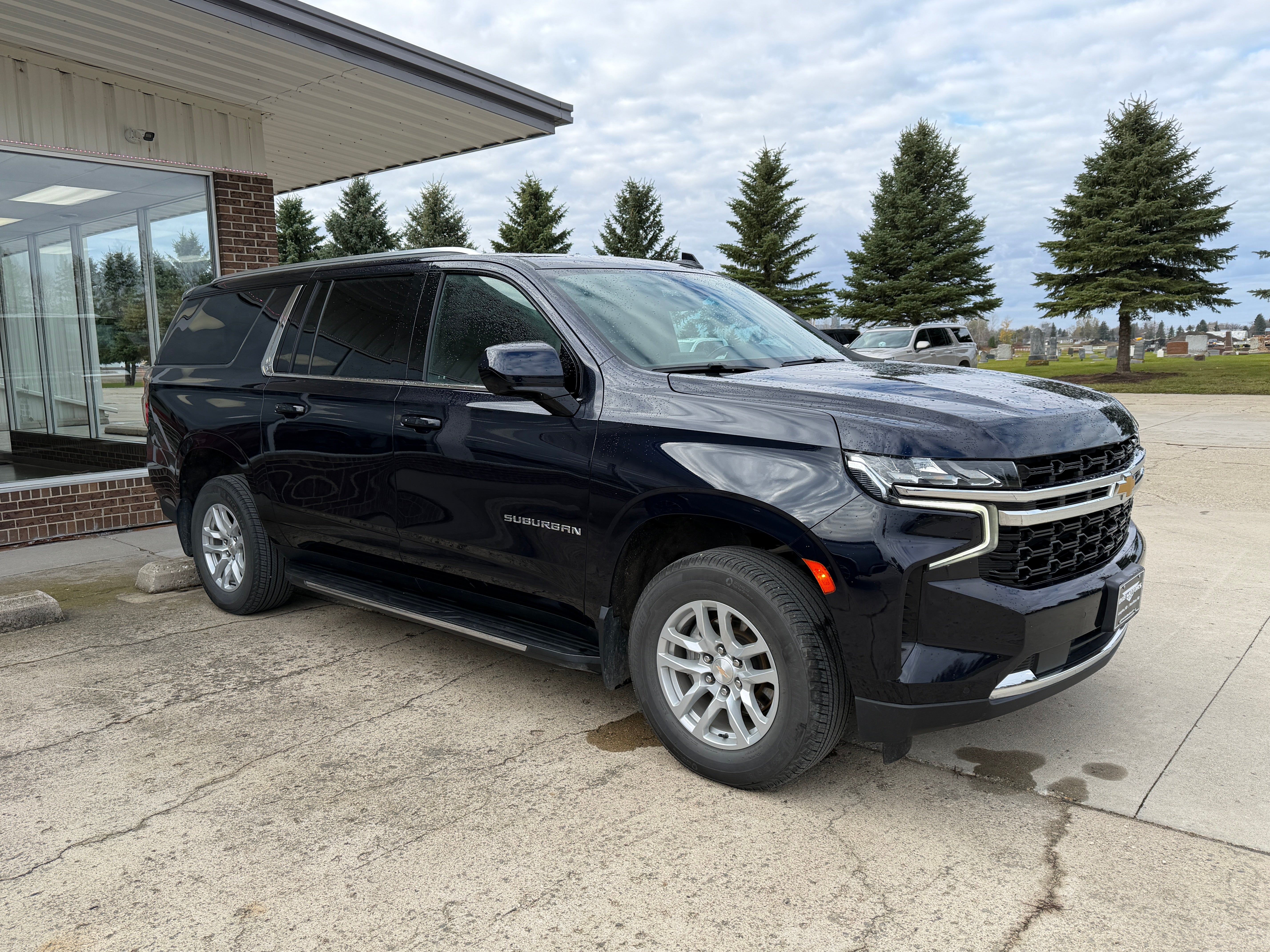 2022 Chevrolet Suburban LS in Midnight Blue Metallic — front three-quarter view