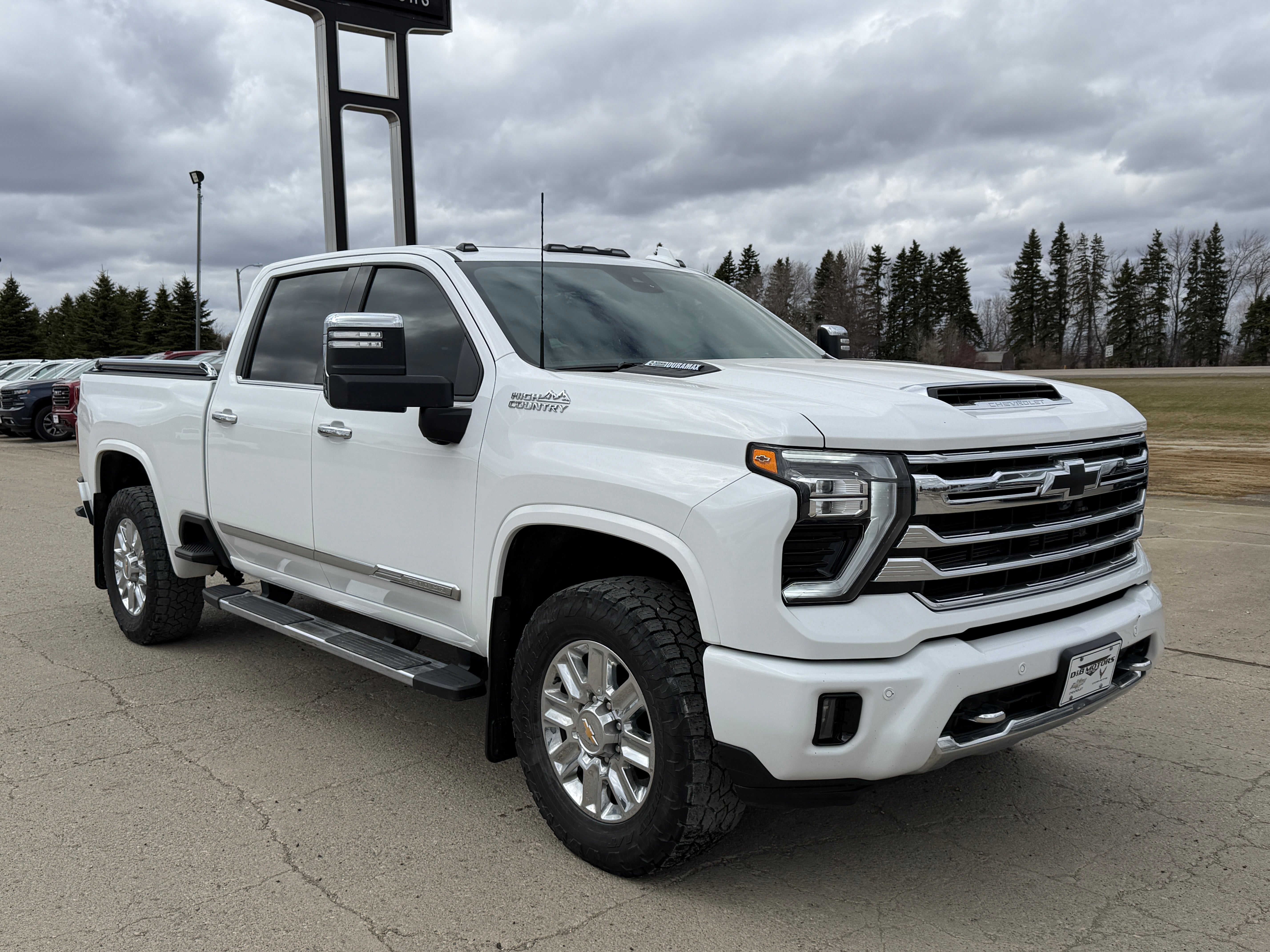 2024 Chevrolet Silverado 2500 HD High Country in Summit White — front three-quarter view