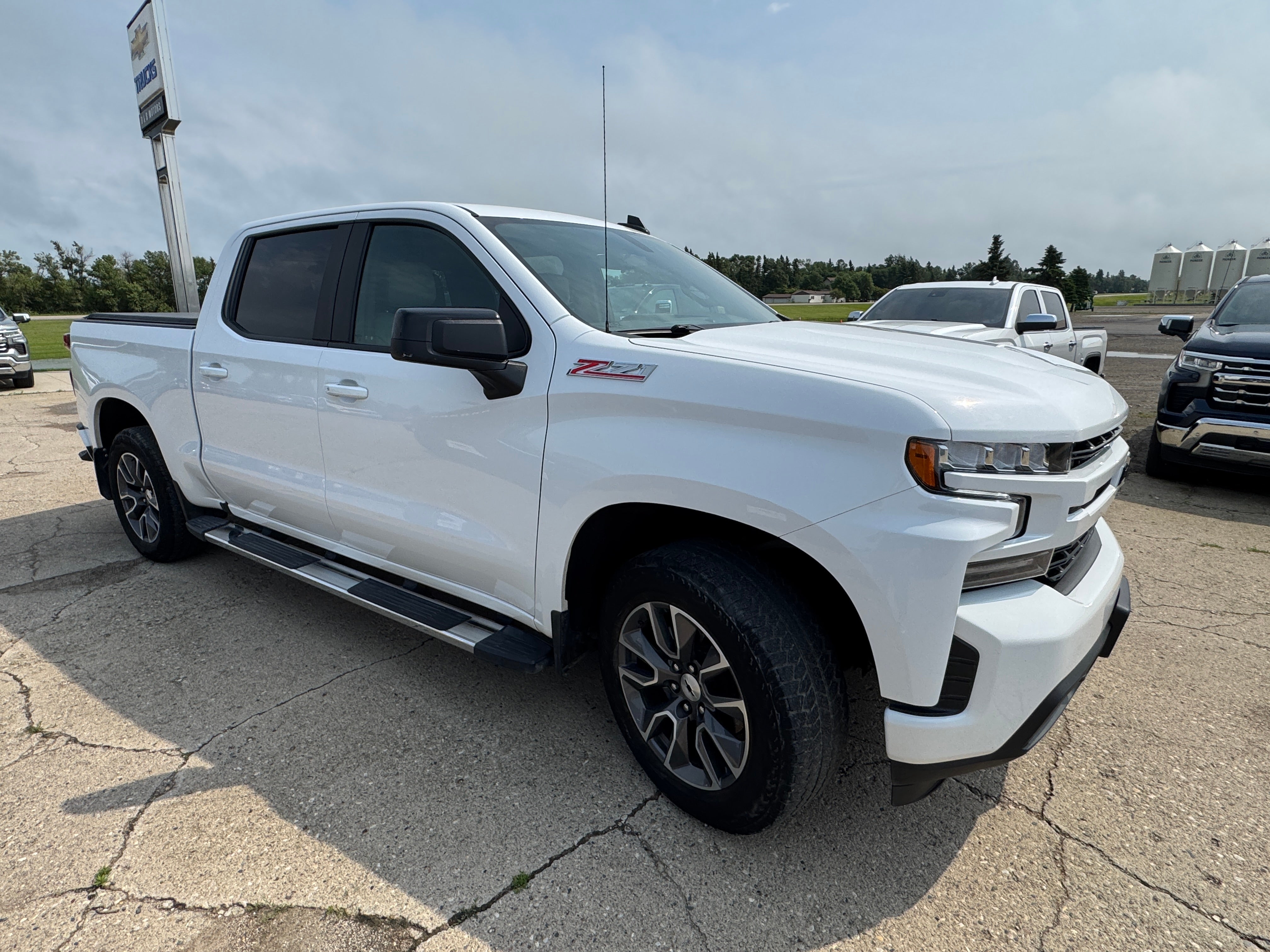 2021 Chevrolet Silverado 1500 RST in Summit White — front three-quarter view